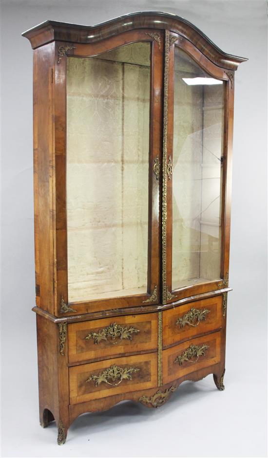 A 19th century French serpentine walnut and ormolu mounted display cabinet, W.4ft H.6ft 10.5in.